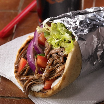 Shredded beef gyro wrapped in foil