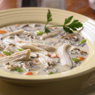 Shredded chicken wild rice soup in a bowl