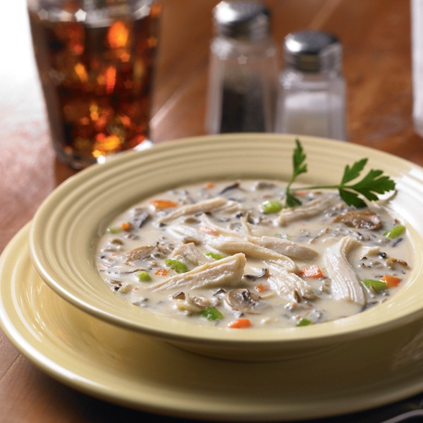 wild rice soup with shredded chicken in a bowl