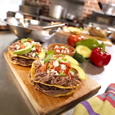 Mexican shredded pot roast tostadas on a tray