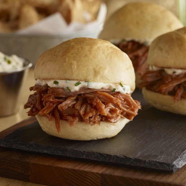 Pot roast sliders with garlic aioli on a tray