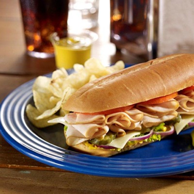 Classic turkey and swiss sub with a side of chips
