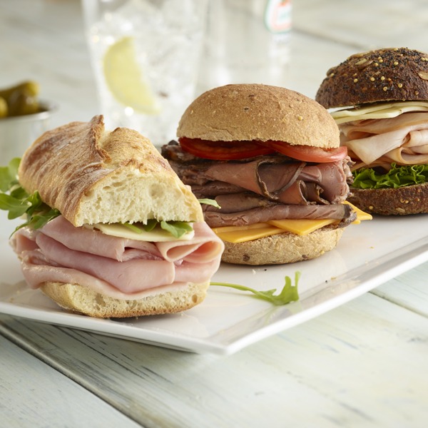 ham, turkey, and beef sliders on a plate