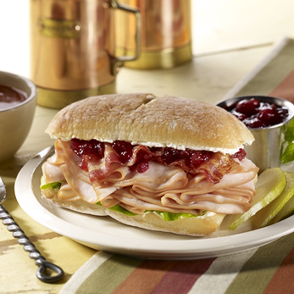 Cranberry turkey club roll on a plate