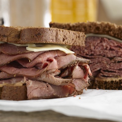 Sliced pastrami sandwich with Swiss cheese