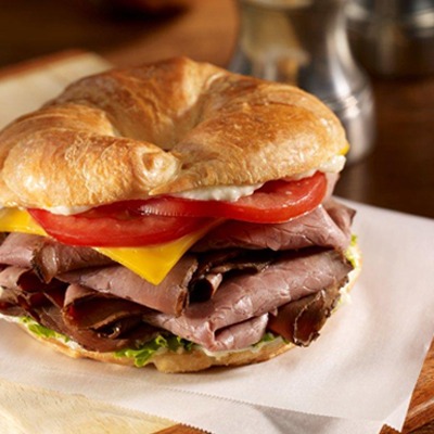 Monterey black and blue croissant sandwich on a paper wrapper