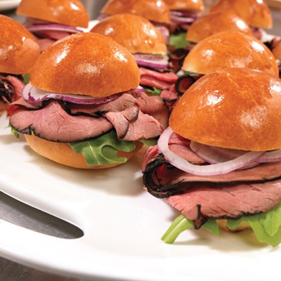 Brioche roast beef sliders on a serving tray