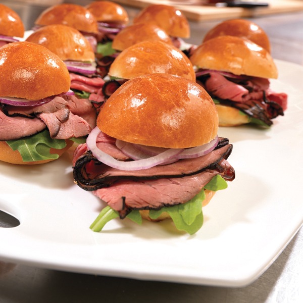 Brioche roast beef sliders on a serving tray