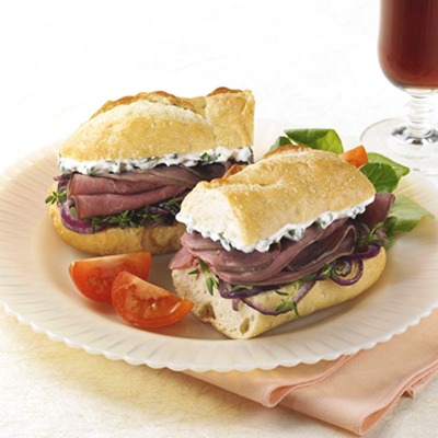 Sour cream and onion beef sandwich on a plate