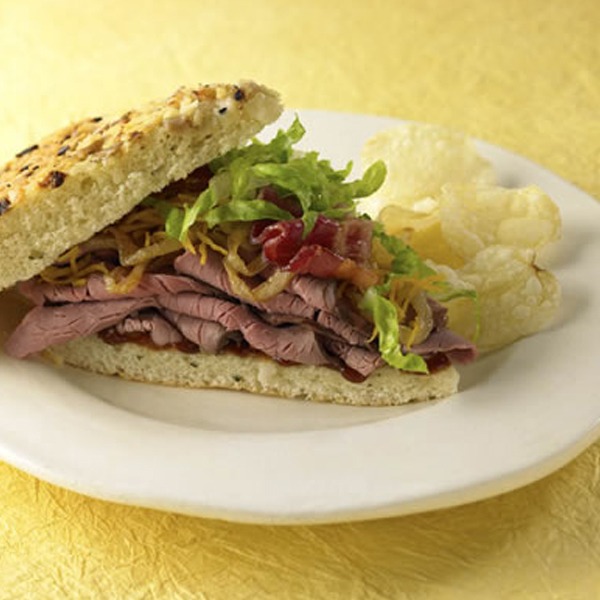 Beef and bacon focaccia sandwich on a plate