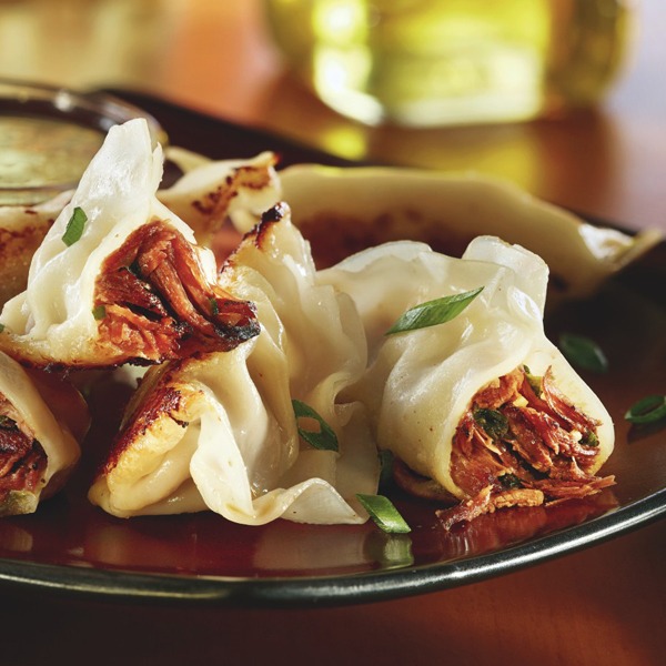 Seared garlicky pot roast dumplings on a plate