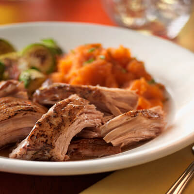 Southern style pork pot roast in a bowl with veggies