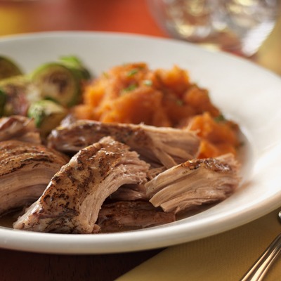 Southern style pork pot roast in a bowl with veggies