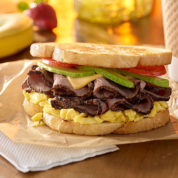 Steak and egg breakfast sandwich on a paper wrapper