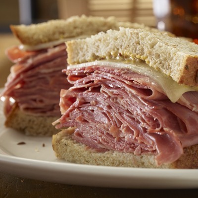 Sliced corned beef sandwich on a plate