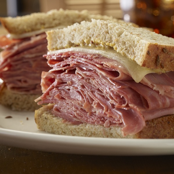 New York deli sliced corned beef sandwich on a plate