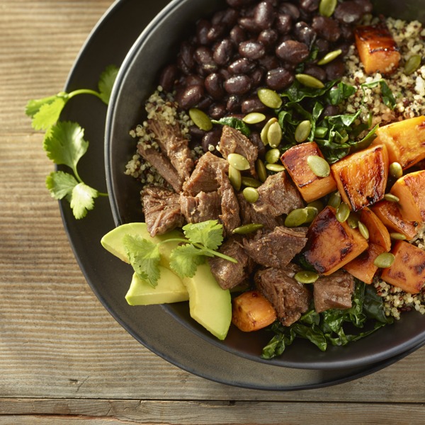 Pot roast beef bowl with beans, quinoa, sweet potatoes, avocado, cilantro, and pumpkin seeds