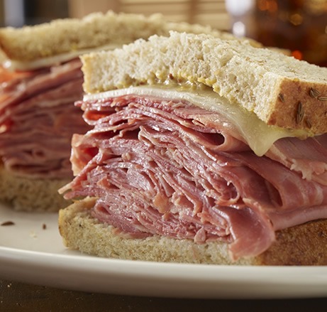 New York deli sliced corned beef sandwich on a plate