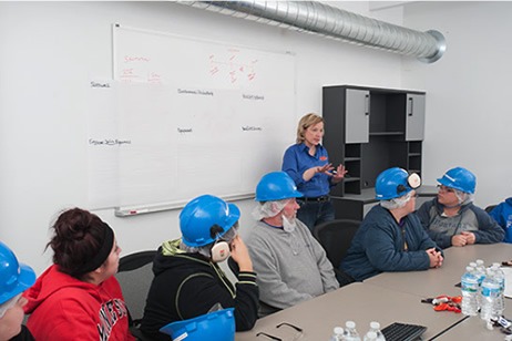 Employees talking in a conference room