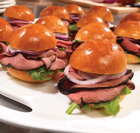 Brioche roast beef sliders on a serving tray