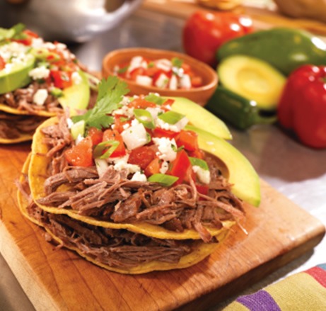 Mexican pot roast tostadas on a tray