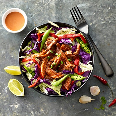 Pulled beef sriracha cabbage in a bowl