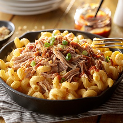 Pulled pork mac and cheese in a skillet