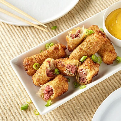 Pulled meat spring rolls on a tray