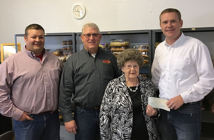 Four people holding a check at Browerville Food Shelf